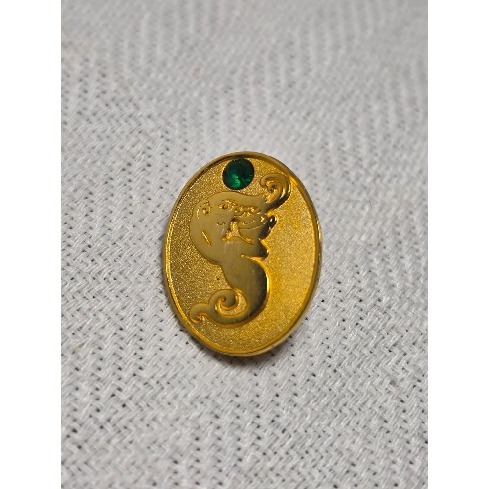 Starbucks manager pin featuring a green gem replacement collectible